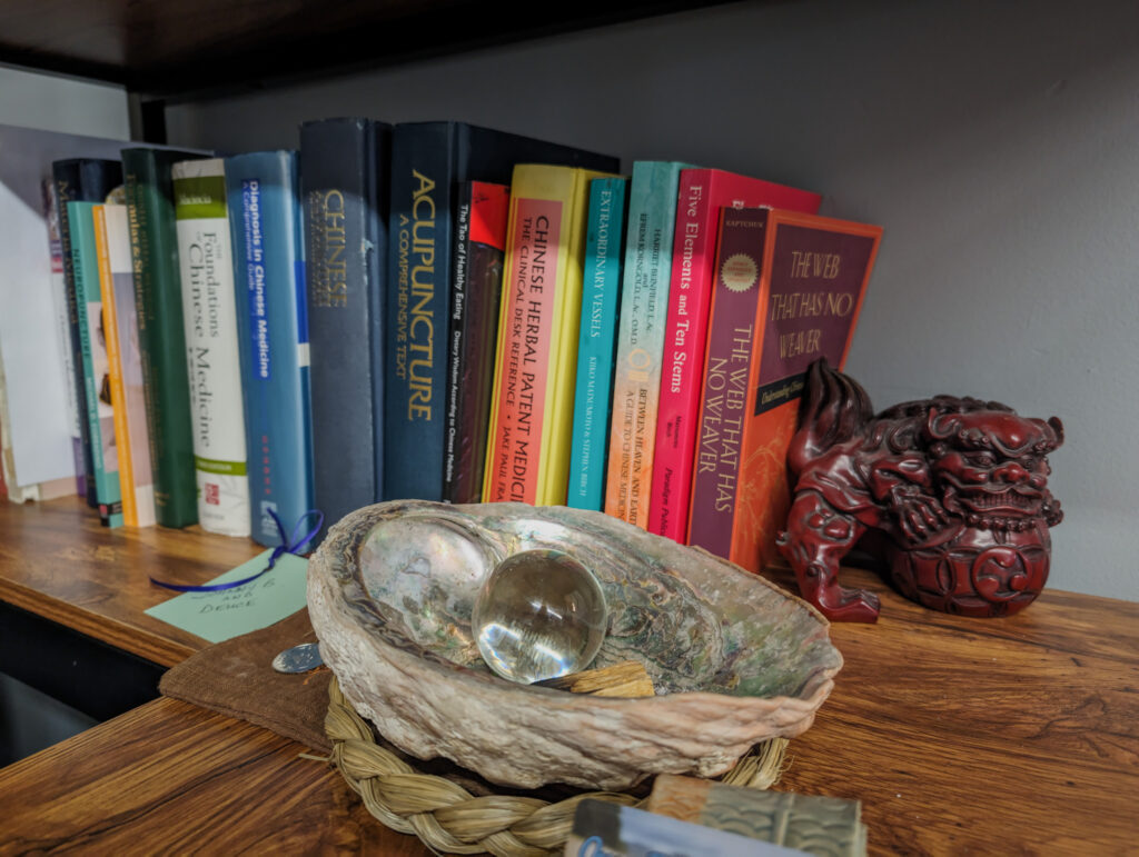 Acupuncture books and decorative table elements